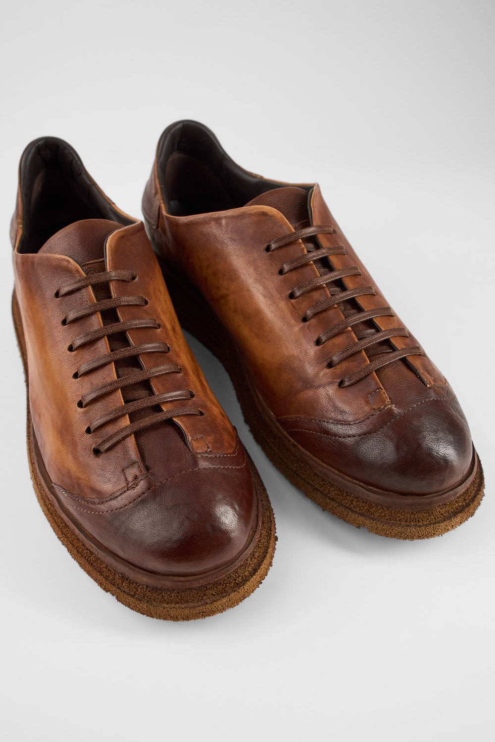 AJAX cognac distressed lightweight hybrid sneakers.