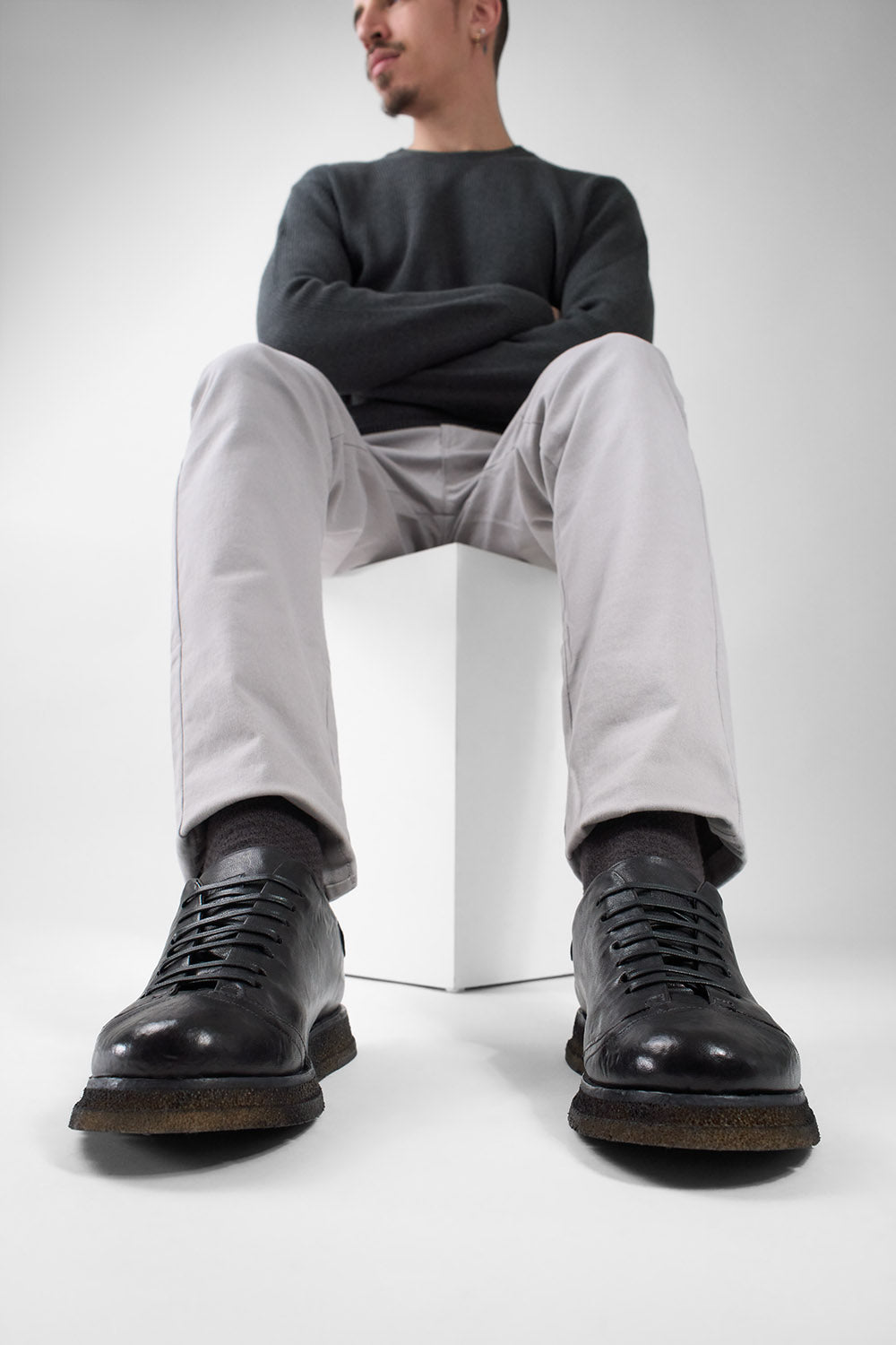 AJAX black distressed lightweight hybrid sneakers.