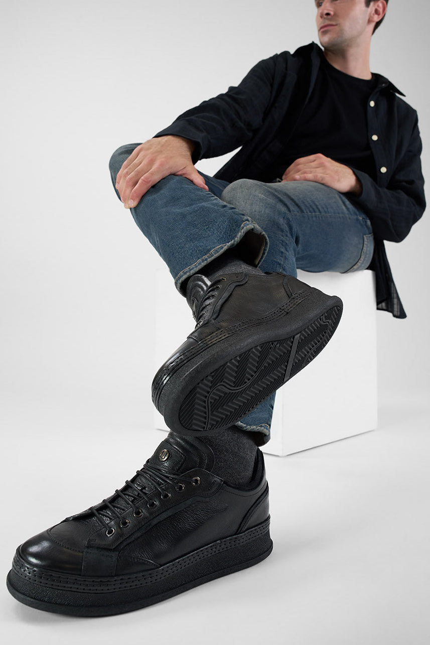 COLE rugged-black welted distressed sneakers.