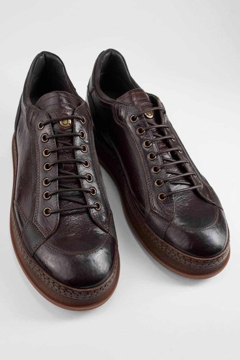 COLE dark-cocoa welted distressed sneakers.