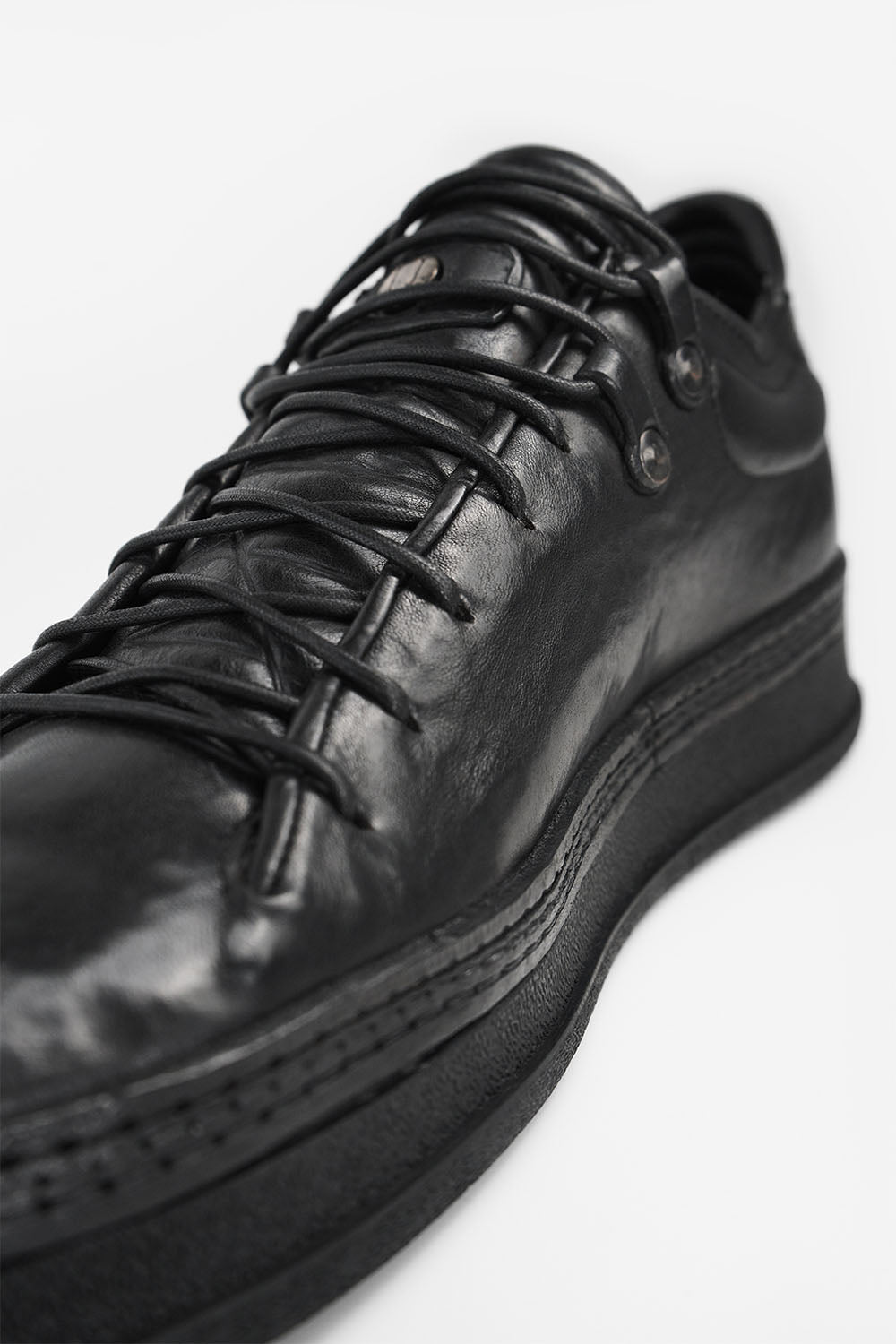 COLE rugged-black welted distressed loop sneakers.