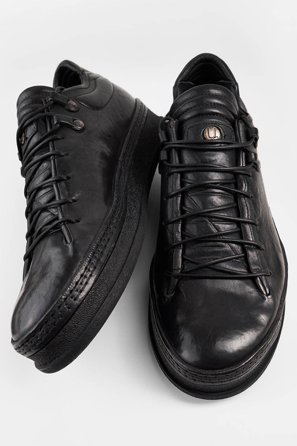 COLE rugged-black welted distressed loop sneakers.
