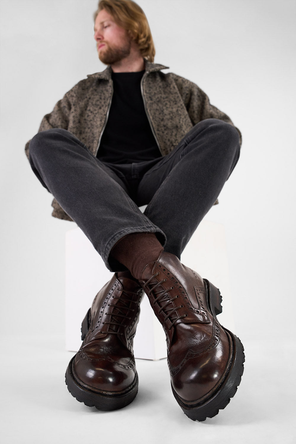 DRAKE dark-chestnut brogue chukka boots.