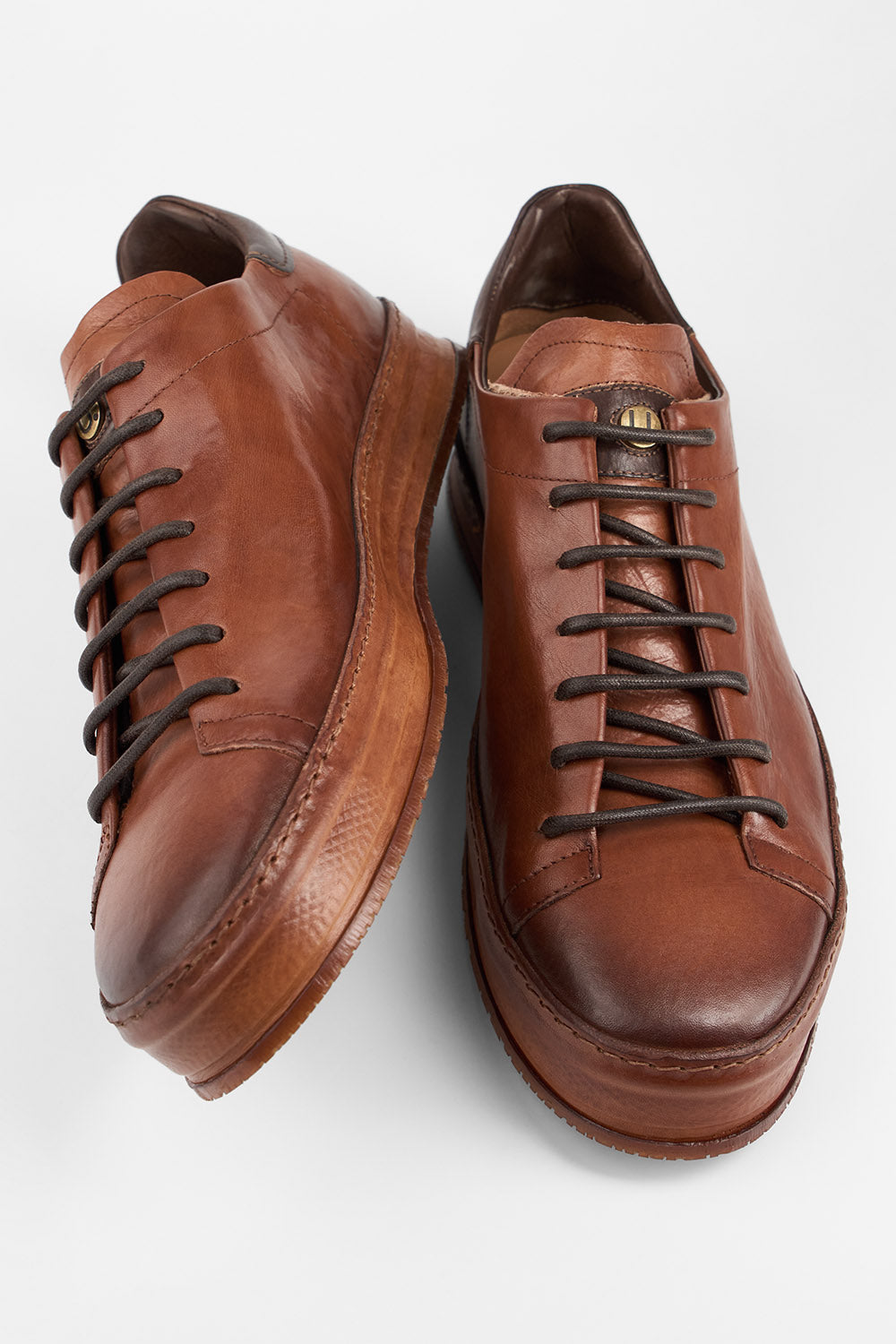 HAYES cognac distressed welted sneakers.