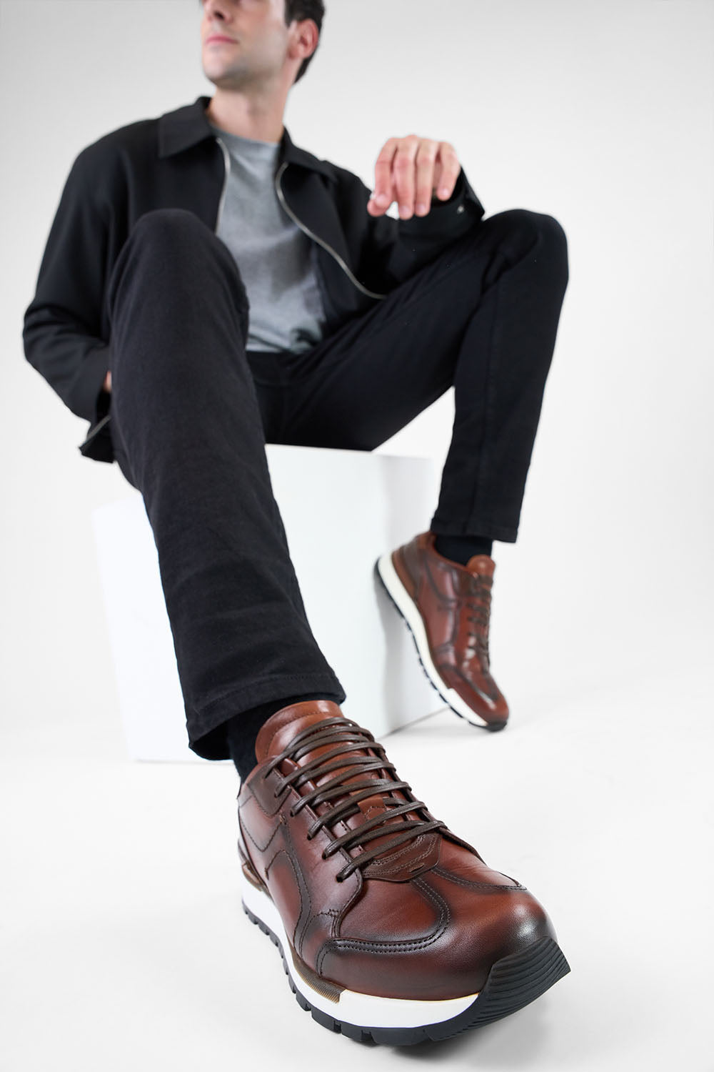 OWEN cocoa-brown triple stitched wingtip patina runners.