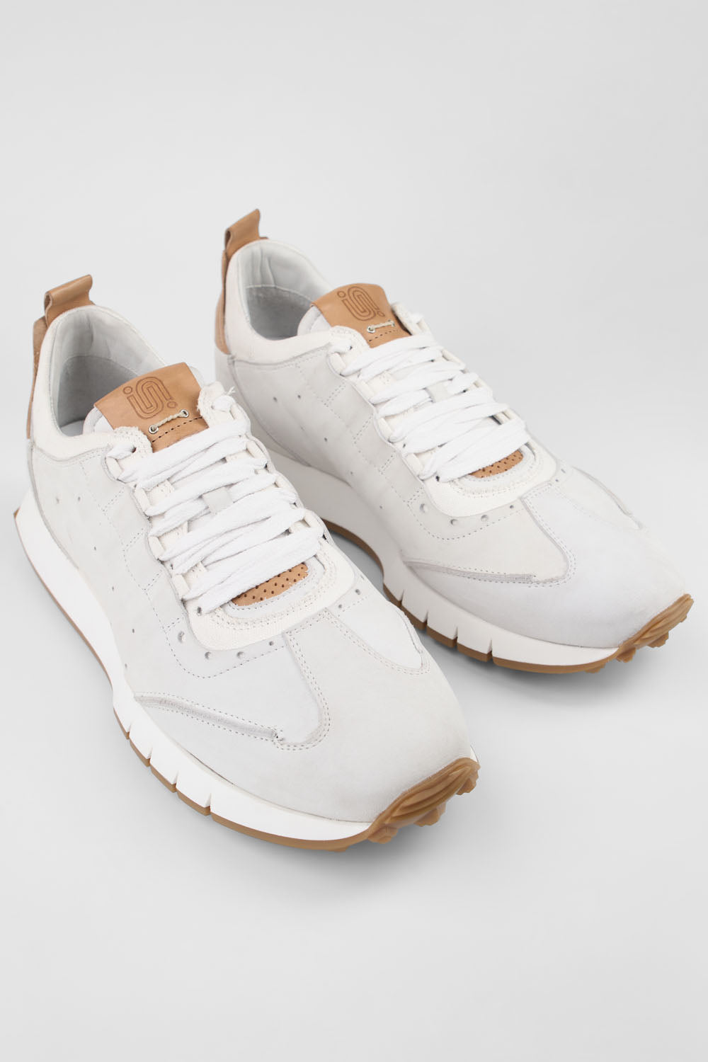 PEARCE limestone-white nubuck wingtip runners.