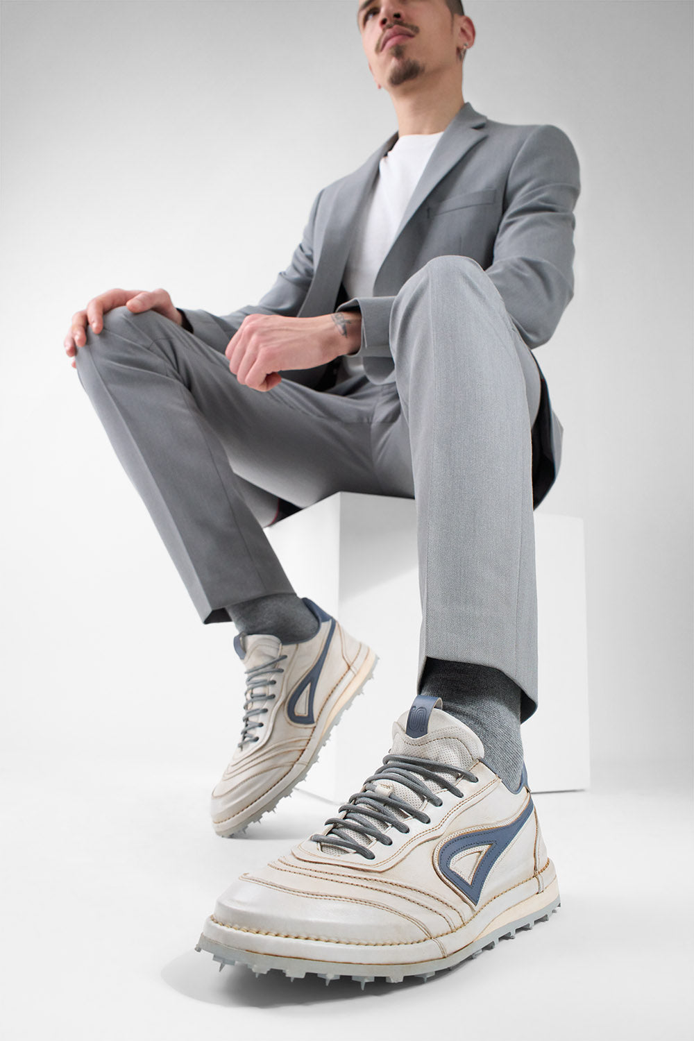 WYRE off-white & blue nappa sneakers.